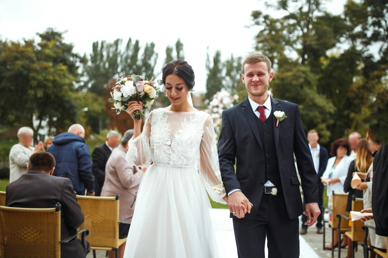 happy-groom-and-beautiful-bride-wedding-ceremony-under-the-arch-decorated-with-flowers-wedding-day-.jpg